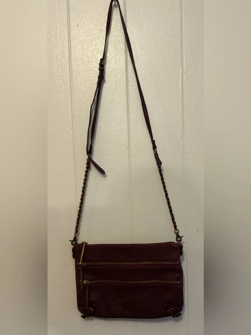 a Vintage Rare Elliott Lucca burgundy Leather laser-cut leather crossbody bag